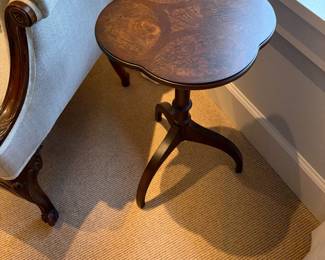 Scallop edge, small antique table 12 inches wide by 12 inches deep by 22 inches high.