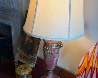 $1400 French urn shaped red and white marble set of lamps with ormolu goat, heads and flower sway. Silk shade. 33 inches high to the finial on top of the shade. Urns are each 18 inches high.
