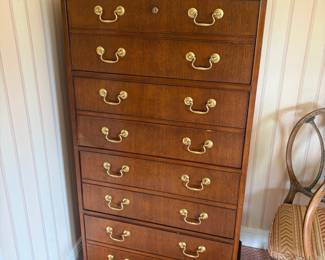 Filing cabinet made to appear like a tallboy chest of drawers.