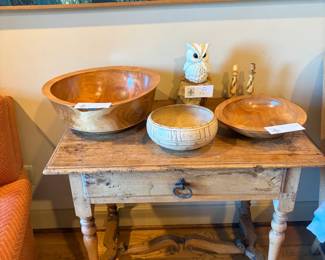 Handturned cherry bowls and other collectibles for sale during in-person shopping.