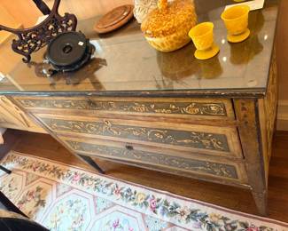 $3800 Italian inlaid chest of drawers late 18th to early 19th century. Three drawers and has a brass sketch in Locke plate that needs reattachment. The top is mounted by a marble slab with protective glass surface. 45 inches wide by 21 inches deep by 35.5 inches high.