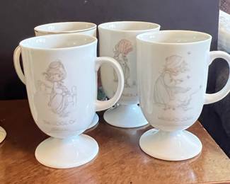Precious Moments "The Voice of Spring" and "Winter's Song" Pedestal Mugs (Set of 2)