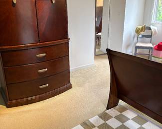 Wardrobe armoire with 3 lower drawers, and view of the footboard to the king sleigh bed