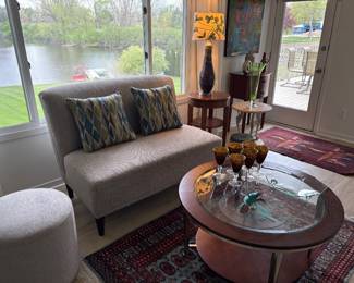 Loveseat, round 2-tier coffee/cocktail table, ottoman, side tables and 100% wool area rugs