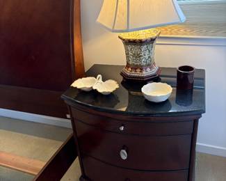 nightstand with black granite top, ceramic lamp and Lenox dishes