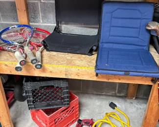Camping chairs, vintage tennis, rackets, and industrial extension cords
