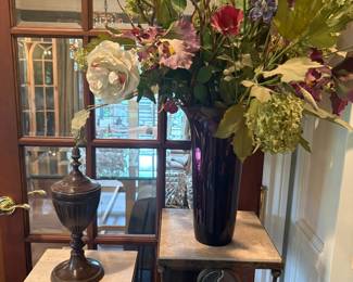 Metal urn, metal and travertine pedestals, faux floral arrangement