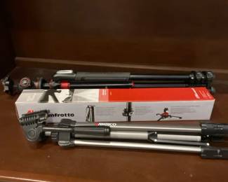 Two Tripods And One Monopod