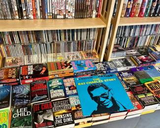 Hardcover books, DVDs ($2.00 each), paperback books, CD's, VHS tapes ($1.00 each)