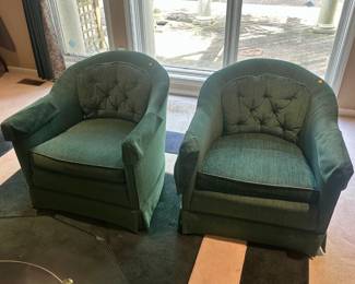 Pair of green upholstered swivel armchairs. $25.00 each