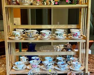 Novelty porcelain teapots ($10.00 each), china teacups and saucers ($5.00 each), glass pedestal bowl ($100.00)