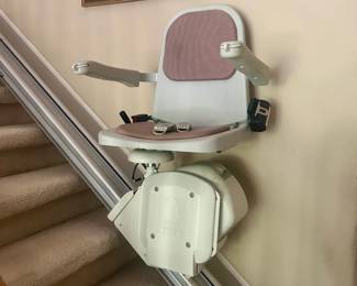 Acorn Superglide 120 straight stairlift, featuring a motorized chair and rail system, reaches 14 steps. $400.00
