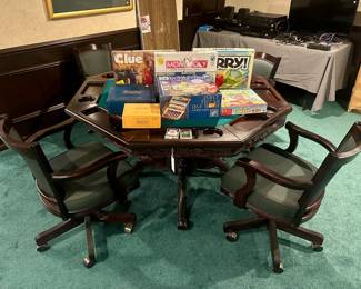 Game table with four rolling armchairs ($300.00), boardgames ($1.00 to $5.00)