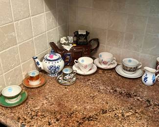 China teacups and saucers ($5.00 each), novelty teapot ($25.00)