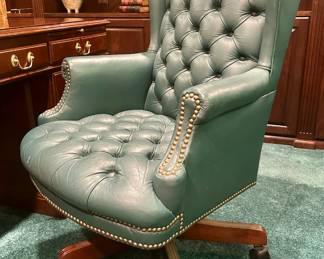 Green tufted leather desk chair. $200.00