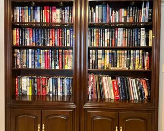 Bookcases ($100.00 per section), hardcover books, DVDs ($2.00 each), paperback books, CD's, VHS tapes ($1.00 each)