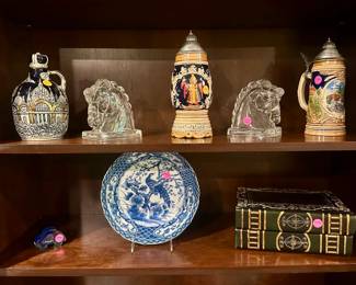 Vintage Tilso liquor decanter music box ($25.00), Federal glass horsehead bookends ($10.00 pair), Munich stein music box ($25.00), German stein ($10.00), Kosta Boda art glass car ($10.00), Blue and White porcelain plate ($10.00), wooden faux books box ($10.00)