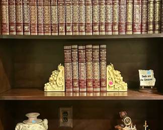 Leather bound books ($2.00 each), decorative bookends ($10.00 for the pair), decorative pottery jar ($5.00), novelty wooden box ($10.00)