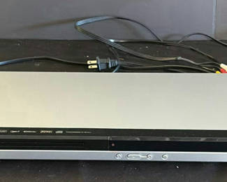 Lot 33: RCA DVD player, Shark handheld vacuum, and power strips with cords