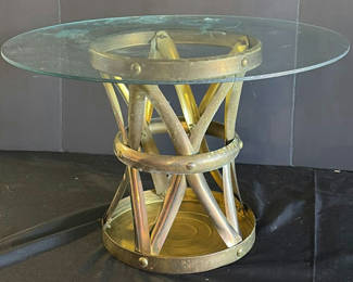Lot 37: Glass-top table, round leather ottoman, and wooden tray