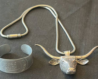 Lot 209: Longhorn bull head pendant necklace and engraved cuff bracelet