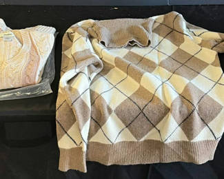 Lot 74: Beige argyle sweater, pink cable-knit sweater, cream cashmere cardigan, and gloves