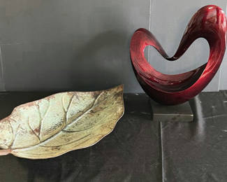 Lot 162: Leaf-shaped ceramic dish and red curved sculpture