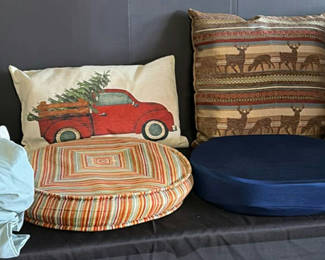 Lot 84: Decorative Pillows, Round Ottomans, Bedding, and Kodak EasyShare S730 Box