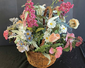 Lot 38: Wicker baskets with a floral arrangement