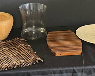 Lot 164: Wooden bowl, glass vase, bamboo placemat, slatted wooden trivet, and round beige disc