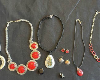 Lot 201: Red cabochon necklaces with assorted pendants and earrings