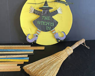 Lot 32: Halloween decor set: witch sign, straw broom, pumpkin centerpiece, and wooden rulers
