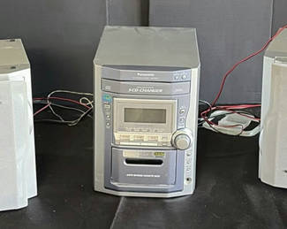 Lot 180: Panasonic CD stereo system with speakers and CD collection