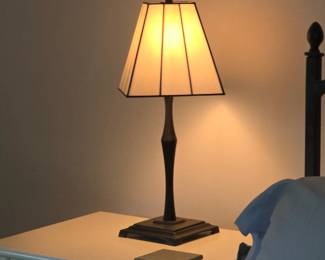 Arts and Crafts slag stained glass shade table lamp with a dark metal base