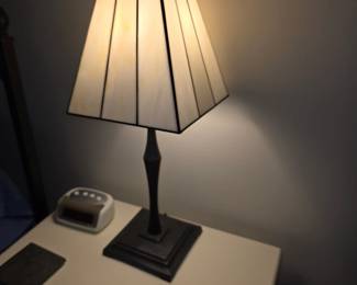 Arts and Crafts slag stained glass shade table lamp with a dark metal base