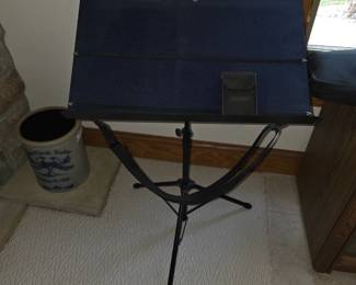                    This is a Portastand Troubadour music stand in blue, featuring a portable tripod base and a durable nylon desk cover.