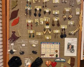 Lots of brooches and earrings