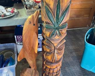 Carved dolphin & totem pole