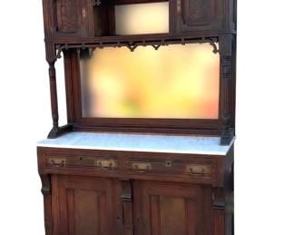Nolde Family two piece Eastlake marble top sideboard with cabinet upper
