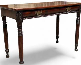 Mahogany transitional serving table with carved apron