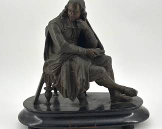 Seated bronze sculpture of gentleman