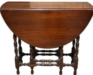 Walnut William and Mary style gate leg table with drawer
