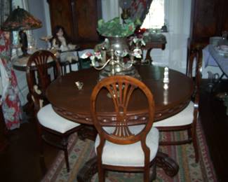 ROUND DINING TABLE, 6 CHAIRS WITH BRASS MOUNTS, SILVER CANDELABRA & MORE