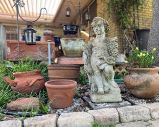 Concrete Statue and Lots of Planters
