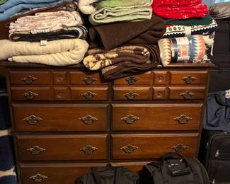 Dresser, luggage and blankets
