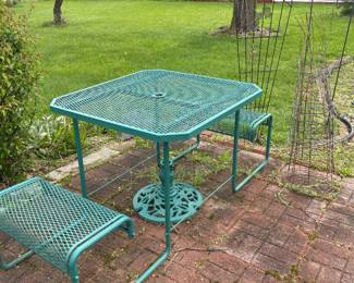 Metal picnic table with attached benches