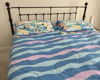 Vintage Black Metal Bed Frame with Tropical Fish and Wavy Stripe Bedding