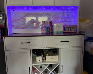 Coffee and wine bar- the pink backdrop can be removed. It is removable wallpaper.