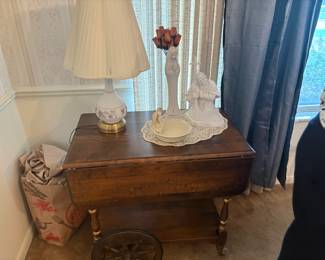 . . . drop-leaf teacart with Madonna statue and accent lamp