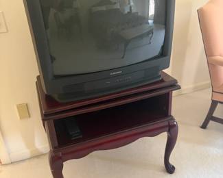 . . . Queen Ann-style accent table and vintage box TV